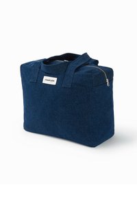 Sac en feutre bleu marine avec double poignées, forme rectangulaire, fermeture éclair et une étiquette sur le devant. Tissu texturé et durable.