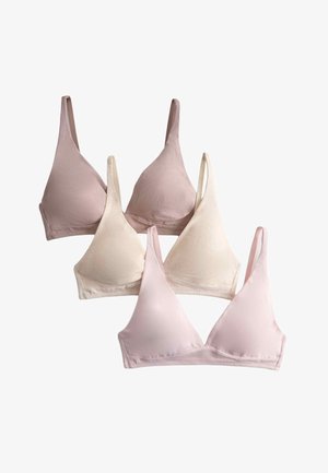 Vier draadloze soft-cup beha's in zachte tinten roze, beige en crème, overlappend gerangschikt op een witte achtergrond.