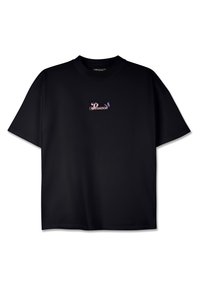 Black t-shirt, short sleeves, round neck. Features a small pink and purple graphic with the word "PEGADOR" centered on the chest.