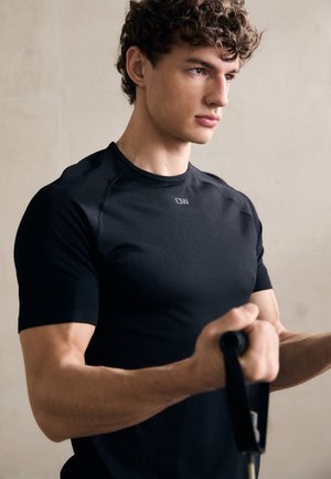 SCULPT SEAMLESS  - T-skjorte til trening - black