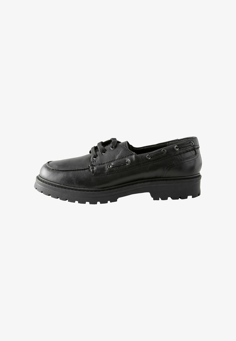 Black leather boat shoe with a rounded toe, low profile, and textured sole. Features eyelets for laces and stitched detailing along the sides.