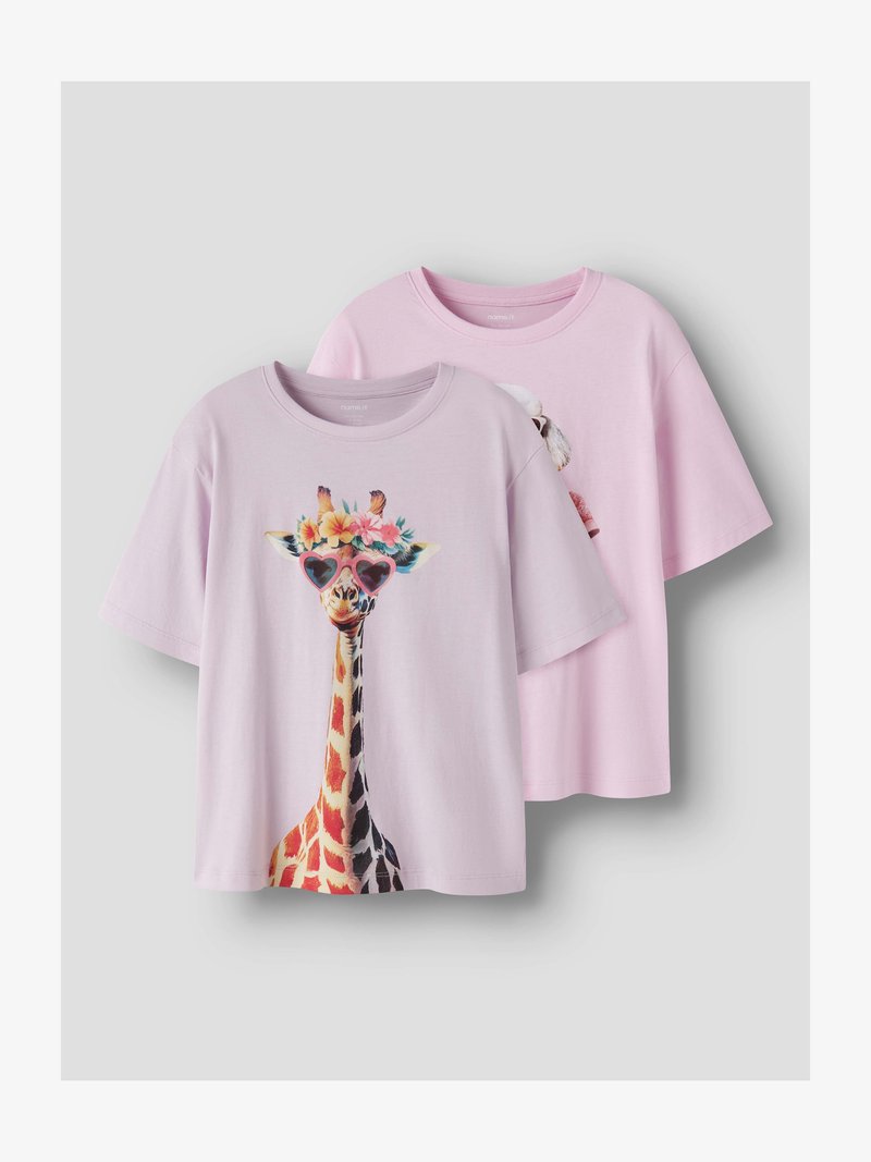 Two pastel pink short-sleeve T-shirts, one with a giraffe wearing heart-shaped sunglasses and flowers on its head.