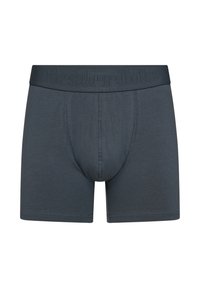 Dark gray boxer shorts with a textured, elastic waistband. Features a supportive pouch and smooth fabric with minimal stitching details.