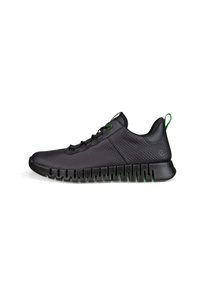 Black athletic shoes with a textured upper, green accents on laces and heel tab, and a ridged black sole for traction.