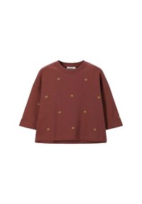 Bordeauxfarbenes Sweatshirt mit kurzen Ärmeln, rundem Halsausschnitt und gleichmäßig über den Stoff verteilten goldenen Muschel-Motiven. Lockere Passform und weich strukturierte Material.