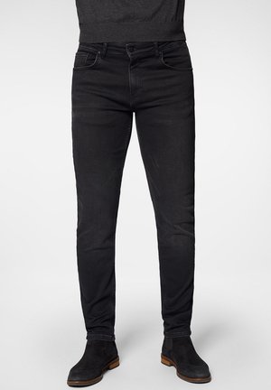 Czarne dżinsy o slim fit, wyposażone w pięć kieszeni, z zapięciem na guzik i subtelnymi detalami szycia. Teksturowana tkanina i elegancki design.