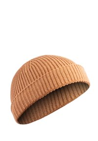 Knit beanie in light brown, featuring a ribbed texture and a soft, stretchable fabric. Rounded top and cuffed edge for snug fit.