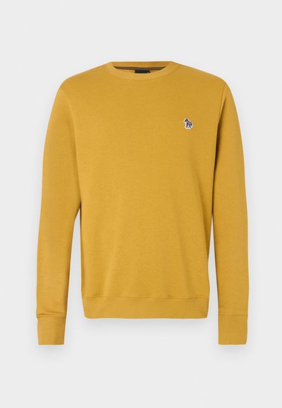 Μουσταρδί φούτερ με στρογγυλή λαιμόκοψη, ραμμένα μανίκια και στρίφωμα, με μικρή κεντητή σχεδίαση στο στήθος. Μαλακή υφή υφάσματος.