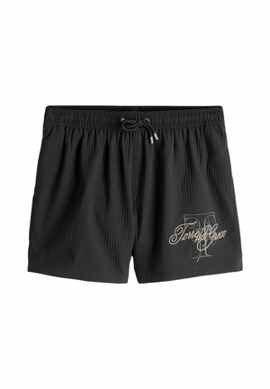 Čierne rebrované plavkové šortky s elastickým pásom, sťahovacou šnúrkou a logom "Torres Greco" v písanom štýle na spodnej ľavej nohe.
