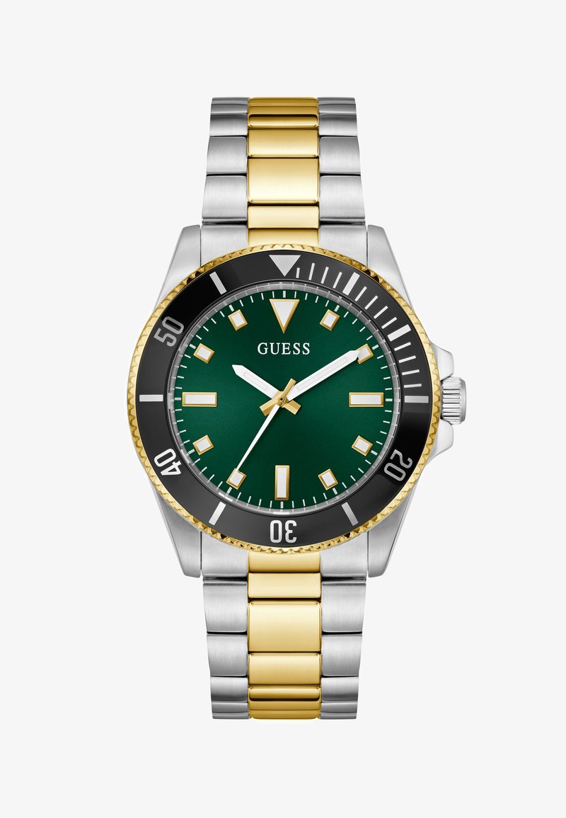 Men's Guess wristwatch with green dial, gold and silver stainless steel band, black bezel, and gold-accented hour markers and hands.