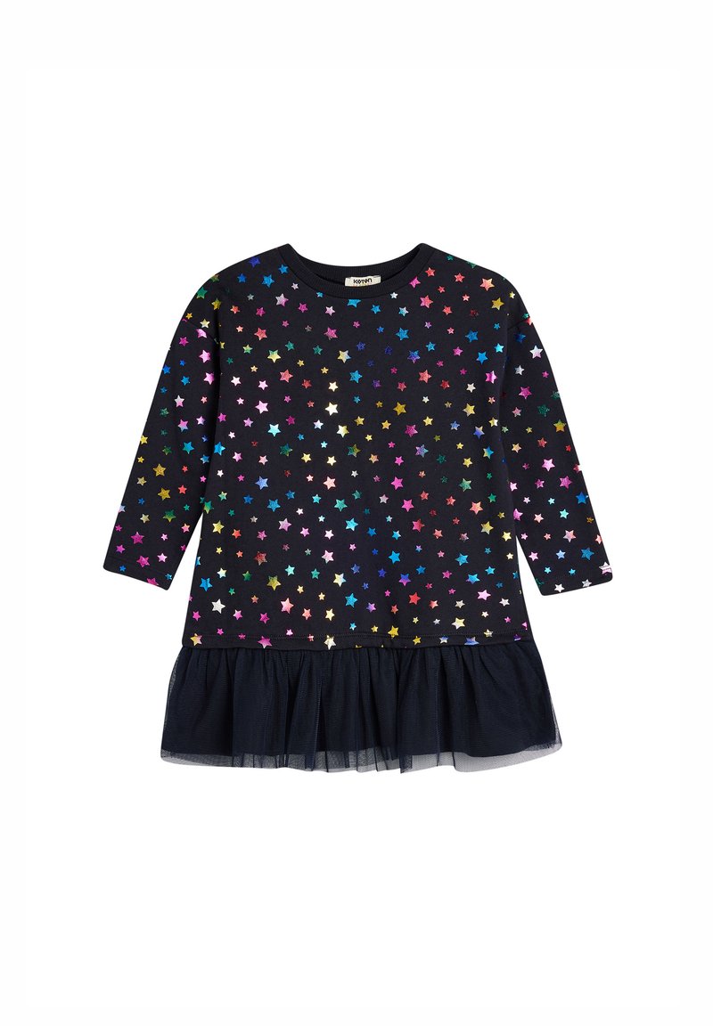Czarna sukienka z długimi rękawami, z wielokolorowymi wzorami gwiazdek i falbaną z tiulu na dole. Miękka tkanina z okrągłym dekoltem.