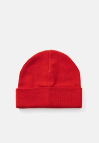 Red knit beanie with a rounded top and a folded cuff. Made of soft, stretchy fabric with a smooth texture. No patterns or hardware visible.