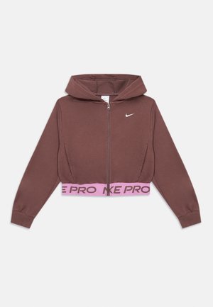 Rudas Nike džemperis su užtrauktuku, gobtuvu ir rausva elastinga juosmens juosta su užrašu „NIKE PRO“ bei baltu Nike ženklu ant krūtinės.