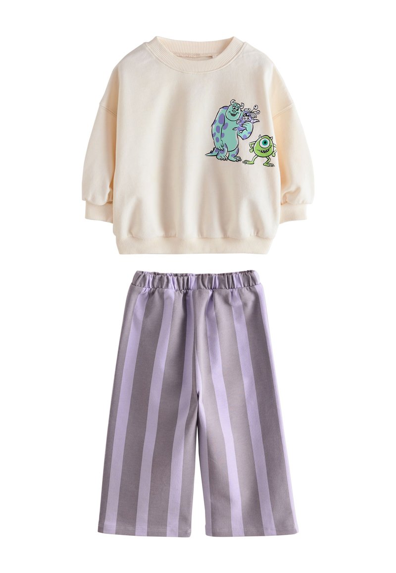 Ensemble de vêtements d'intérieur pour enfants : sweat-shirt crème avec imprimé monstre de dessin animé et pantalon rayé gris-lavande, doté d'une ceinture élastique.