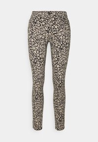 Leggings noirs avec un motif floral beige, dotés d'une coupe ajustée et d'une texture lisse, adaptés pour un port décontracté.