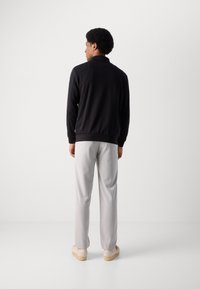 Lindbergh Športna jopa s kapuco na zadrgo - black