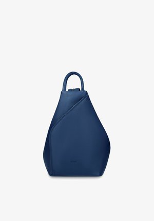 Dark blue leather backpack with a unique triangular shape, single top handle, and a diagonal front zipper detail.