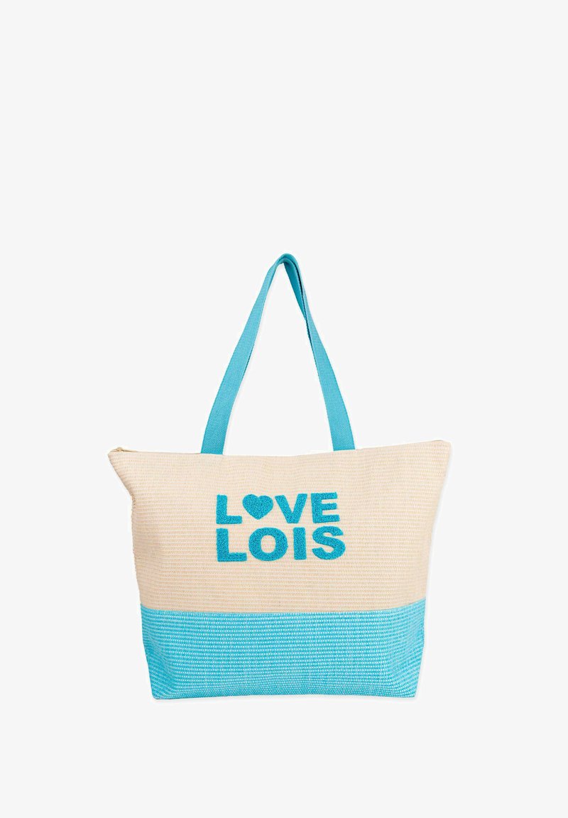 Bolsa de tote de lienzo con asas y sección inferior en turquesa. Presenta "LOVE LOIS" en letras turquesas en negrita y bordadas sobre un fondo beige.
