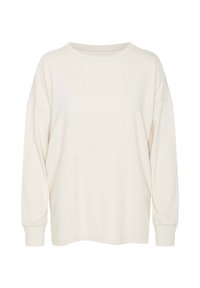 Kremowa koszula z długim rękawem, wykonana z miękkiej bawełny. Posiada okrągły dekolt oraz luźny krój z opadającymi ramionami. Minimalistyczny design, bez wzorów i akcentów.