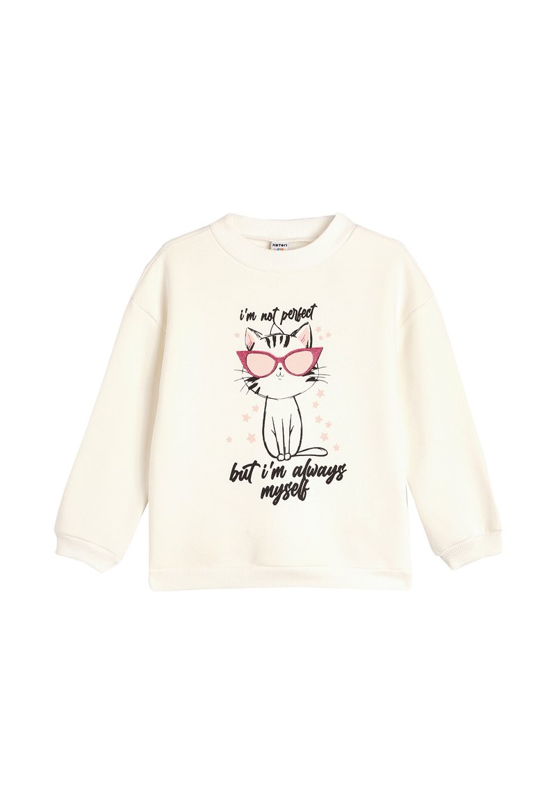 Sudadera blanca con un gato de dibujos animados usando gafas de sol rosa. El texto en negro dice: "no soy perfecto pero siempre soy yo mismo". Tejido suave, corte relajado.