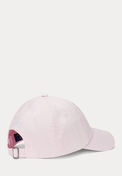 Pink cotton baseball cap with a curved brim, adjustable strap at the back, and light blue embroidered "Polo" logo on the side.
