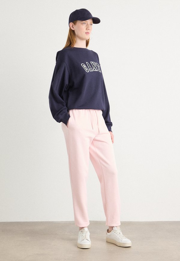 TONAL SHIELD - Tracksuit bottoms - salmon4