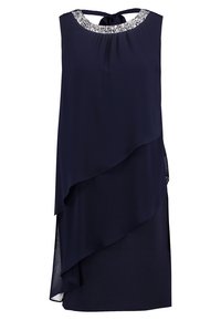 Robe superposée bleu marine avec une texture lisse, mettant en avant un col à motifs scintillants. Se noue à l'arrière pour un ajustement personnalisable.