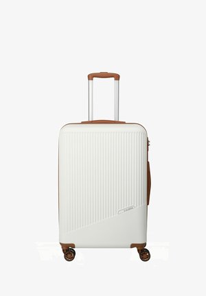 Hard-shell suitcase in white with ribbed texture, brown accents, retractable handle, and four wheels for mobility.
