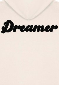 Felpa in beige chiaro con un grande testo nero in rilievo "Dreamer" sul retro. Tessuto morbido con cappuccio regolabile.