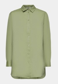Camicia a maniche lunghe verde chiaro con chiusura a bottoni e colletto. Realizzata in un tessuto liscio, presenta una vestibilità comoda e spacchi laterali sull'orlo.