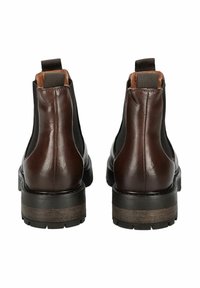 Bottines en cuir marron avec des panneaux élastiques sur les côtés, un talon texturé marron et une finition lisse à l'arrière. Semelle en caoutchouc noir robuste.
