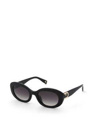 Lunettes de soleil ovales noires avec des verres à dégradé foncé et des accents décoratifs dorés sur les branches, présentées sur un fond blanc.
