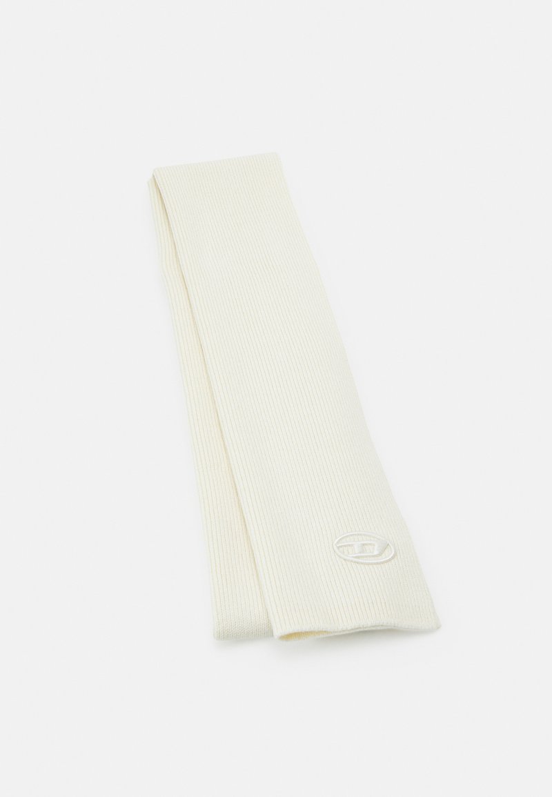 Ribbed cream-colored headband made of soft fabric, featuring a small embroidered logo in a contrasting tone on one side.
