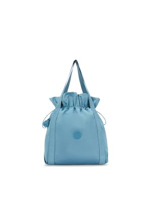 Light blue drawstring bag made of nylon, featuring a structured shape, two shoulder straps, and a round logo detail on the front.