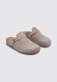 Gray suede clogs with open backs, featuring a single strap with a metal buckle, smooth texture, and a comfortable, rounded shape.