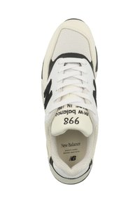 White athletic shoes with black accents, mesh and smooth leather materials, round toe, and prominent branding on the tongue and side.