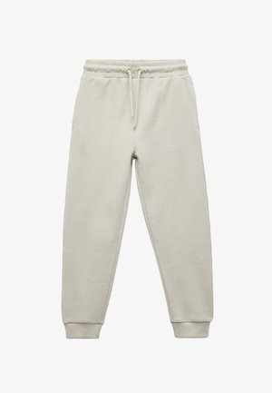 Jasobeżowe dresy wykonane z teksturowanej tkaniny. Posiadają elastyczny pasek w talii ze sznurkiem, kieszenie po bokach oraz zwężane mankiety.