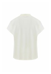Kortärmad, krämfärgad polo-skjorta med klassisk krage och slät tygtextur, med en avslappnad passform och rundad fåll.