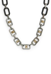 Metal link necklace featuring alternating black rubber and silver-toned rectangular links, with gold accents set within some links.