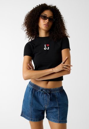 Guess Jeans CROPPED T-SHIRT - T-Shirt print - schwarz