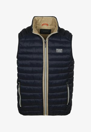 Donkerblauwe gewatteerde mouwloze bodywarmer met beige voering, ritssluiting aan de voorkant, twee ritszakken en New Zealand NZA Auckland-logo op de borst.