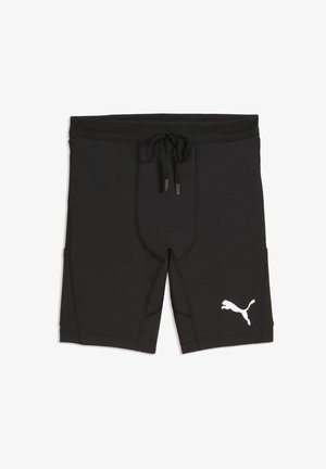 Pantaloncini da bagno neri in tessuto elasticizzato, con vita regolabile con coulisse, cuciture piatte e logo Puma bianco sulla gamba sinistra.