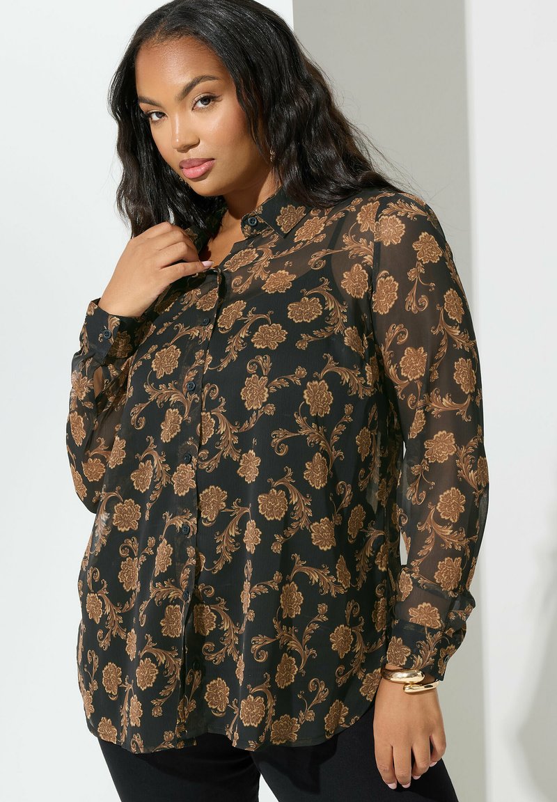 Mustat läpikuultava paita, jossa on monimutkainen kultainen kukkakuvio, napitus edessä, pitkät hihat ja kaulus. Sujuva rakenne, vartalonmyötäinen malli.