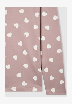 Maglietta a maniche lunghe in tessuto malva con un motivo di piccoli cuori bianchi. Texture liscia con orlo dritto.