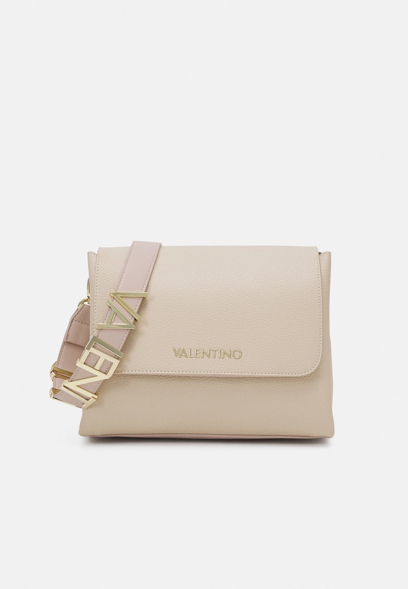 Beige leather crossbody bag with flap closure, gold hardware, and adjustable pink strap featuring "VALENTINO" logo. Smooth texture and minimalist design.