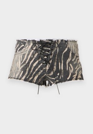 Denim shorts with a black and beige zebra print, featuring a lace-up front, frayed hem, and pockets on each side.