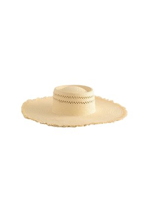 Beez värvi laia äärega kootud õlgest päikesevalli lame kroon ja dekoratiivsed ventilatsiooniavad paela ümber.