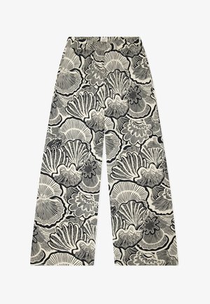 Bukser med vide ben, med et sort-hvidt mønster af muslingeskaller på en lys beige baggrund.