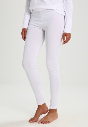 Vita bomull leggings med en figurpassande design och en mjuk textur. Har en enkel elastisk midja och minimala sömmar.