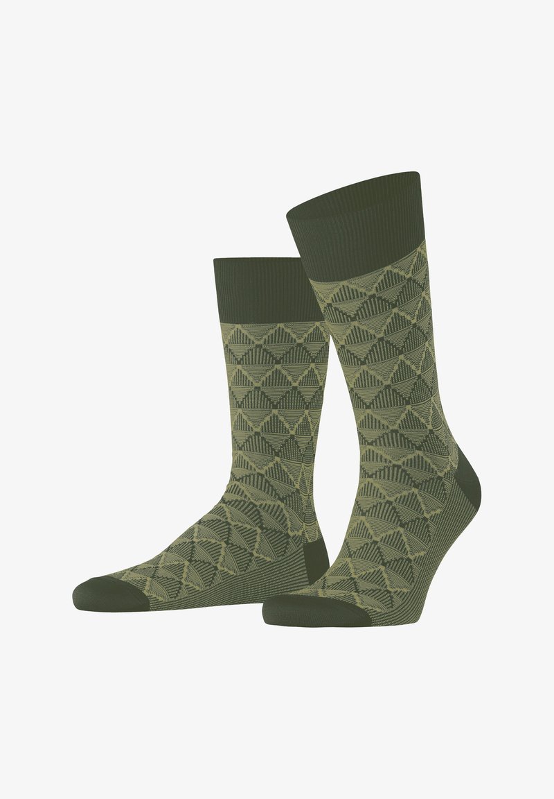 Grüne gemusterte Socken mit einem geometrischen Design, das abwechselnde Texturen und Grüntöne zeigt, gerippter Bund und verstärkter Zehenbereich.